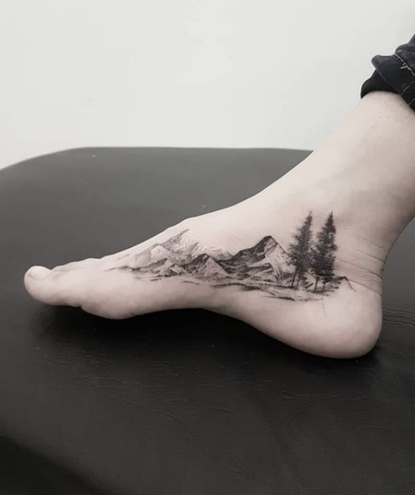 Mountain tattoo located on the ankle